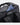 Black backpack with a passport inside on a white background with brand emmeton