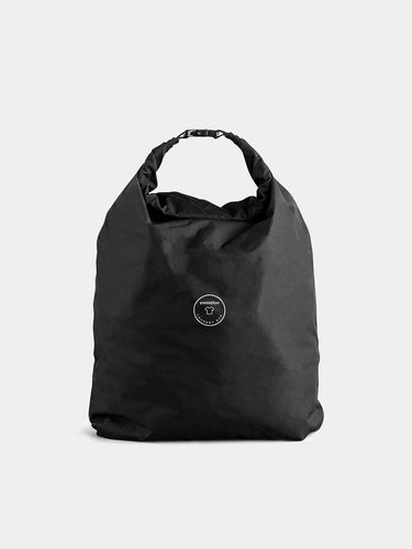 Travel laundry bag with a brand logo on a light gray background