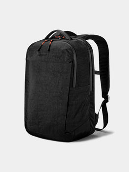 Black backpack on a light gray background