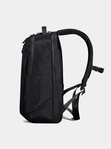 Black backpack on a light gray background