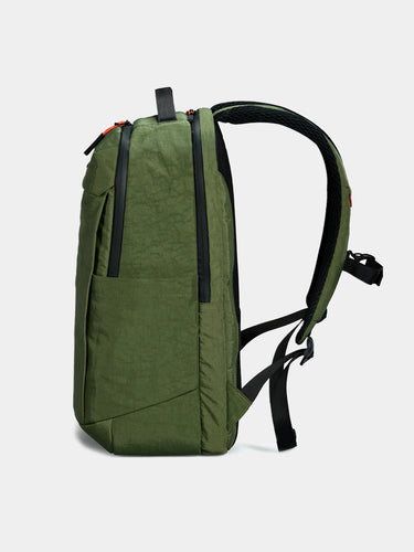 Green backpack on a white background