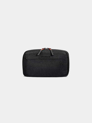 Black tech bag with orange zipper on a light gray background