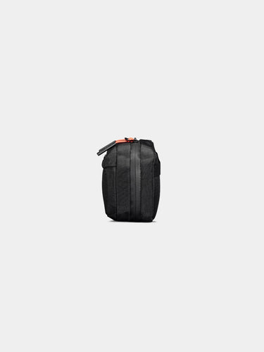 Black backpack with orange accents on a white background