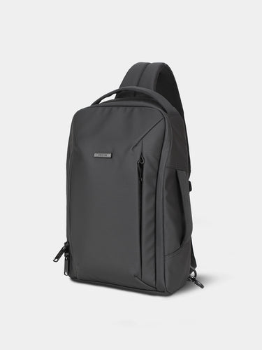 Black backpack on a light gray background