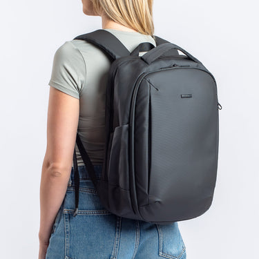 Woman wearing the Commuter Anti-Theft Pack 20L in black