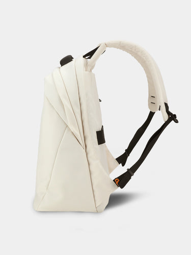 Beige backpack with black straps on a light gray background