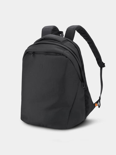 Black backpack on a light gray background