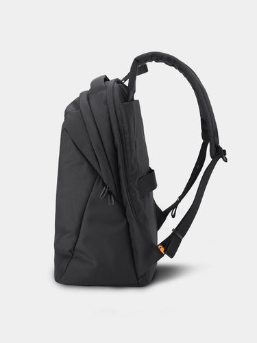 Black backpack on a light gray background