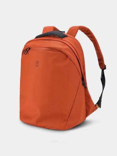 Red / Orange backpack on a light gray background