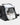 Black duffel bag with white sneakers inside on a light gray background