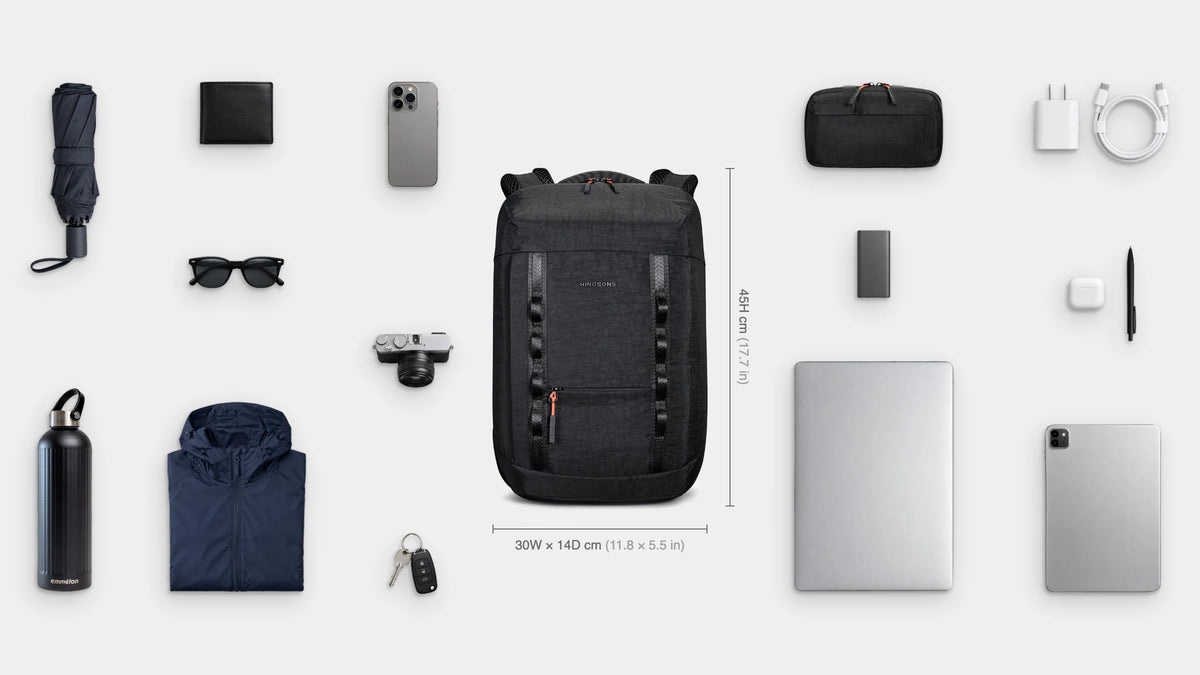 What fits inside the Urban Slim Pack 17.5L: Shown: 16" laptop, iPad, emmèton Flow Tech Pouch, charger and cable, power bank, earbuds, pen, camera, emmèton Thermo Bottle 750ml, packable rain jacket, travel umbrella, sunglasses, wallet, keys, phone.