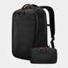 Black backpack with a smaller black pouch on a light gray background