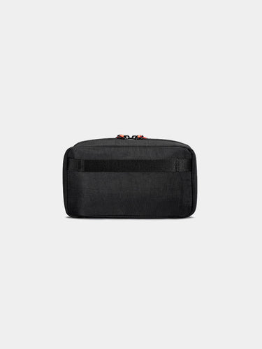 Black toiletry bag on a light gray background
