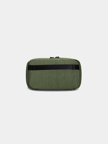 Green tech bag with red zipper on a light gray background