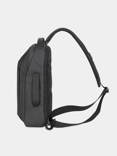 Black backpack on a light gray background