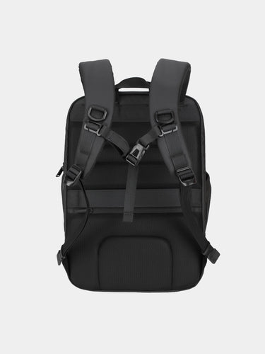 Black backpack with multiple straps on a light gray background
