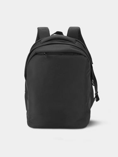 Black backpack on a light gray background