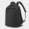 Black backpack on a light gray background