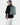 Person wearing a green backpack on a white background