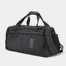 Black duffel bag with shoulder strap on a white background
