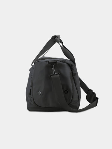 Black shoulder bag on a light gray background