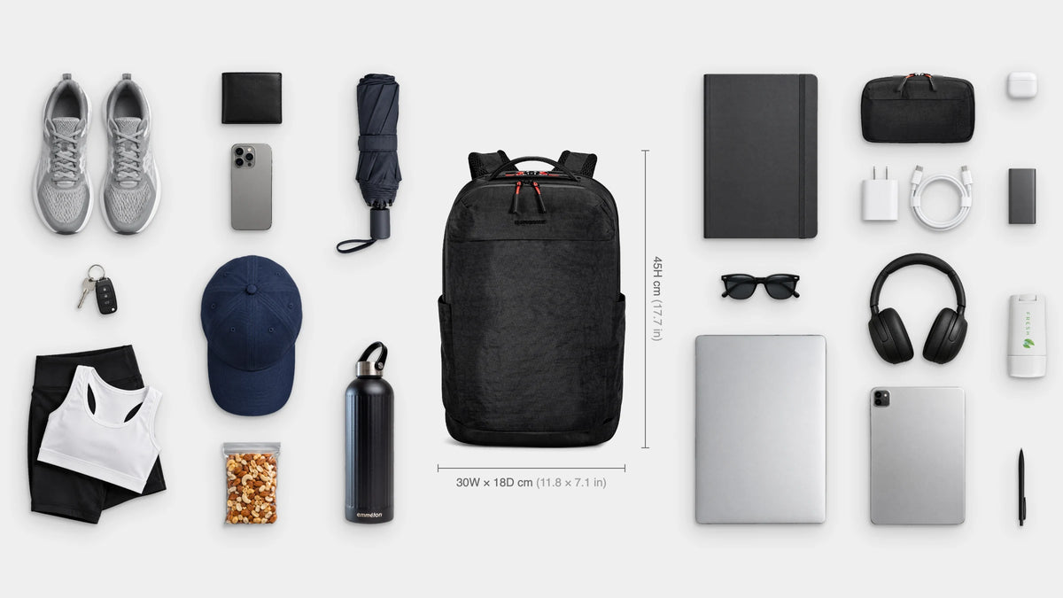 What fits inside the Flow Everyday Pack 22.5L: Shown: 16" laptop, iPad, notebook, emmèton Flow Tech Pouch, charger and cable, power bank, headphones, earbuds, pen, sunglasses, deodorant, shoes, gym kit, cap, emmèton Thermo Bottle 750ml, travel umbrella, snacks, wallet, keys, phone.