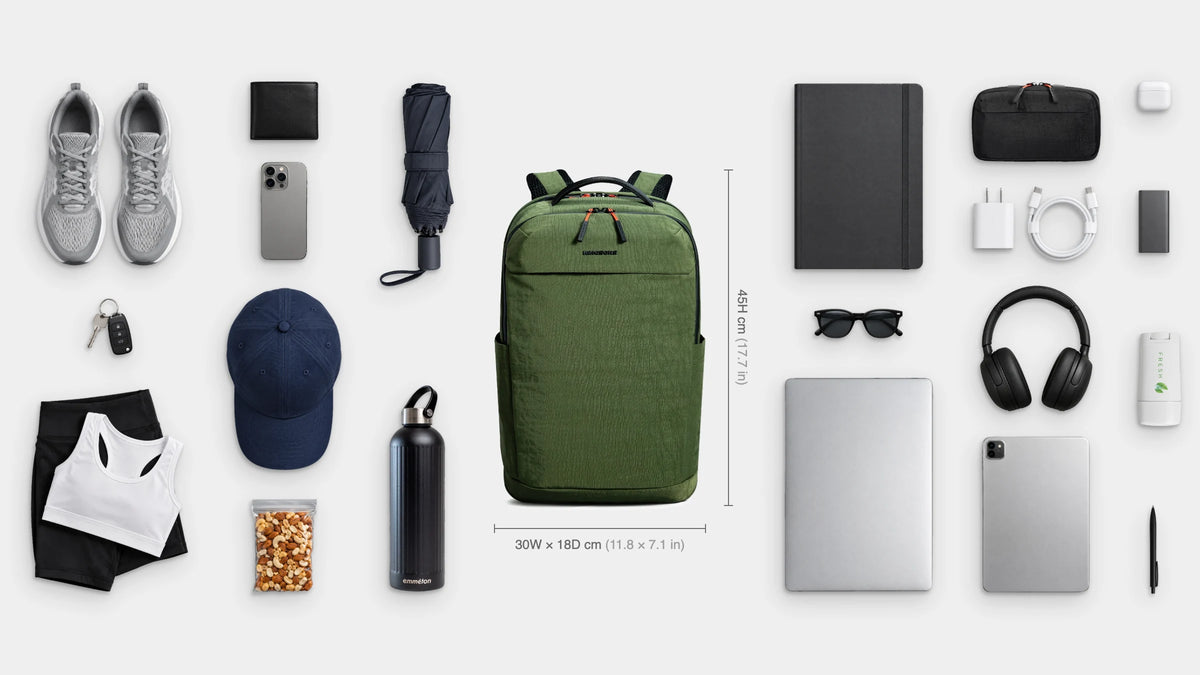 What fits inside the Flow Everyday Pack 22.5L: Shown: 16" laptop, iPad, notebook, emmèton Flow Tech Pouch, charger and cable, power bank, headphones, earbuds, pen, sunglasses, deodorant, shoes, gym kit, cap, emmèton Thermo Bottle 750ml, travel umbrella, snacks, wallet, keys, phone.
