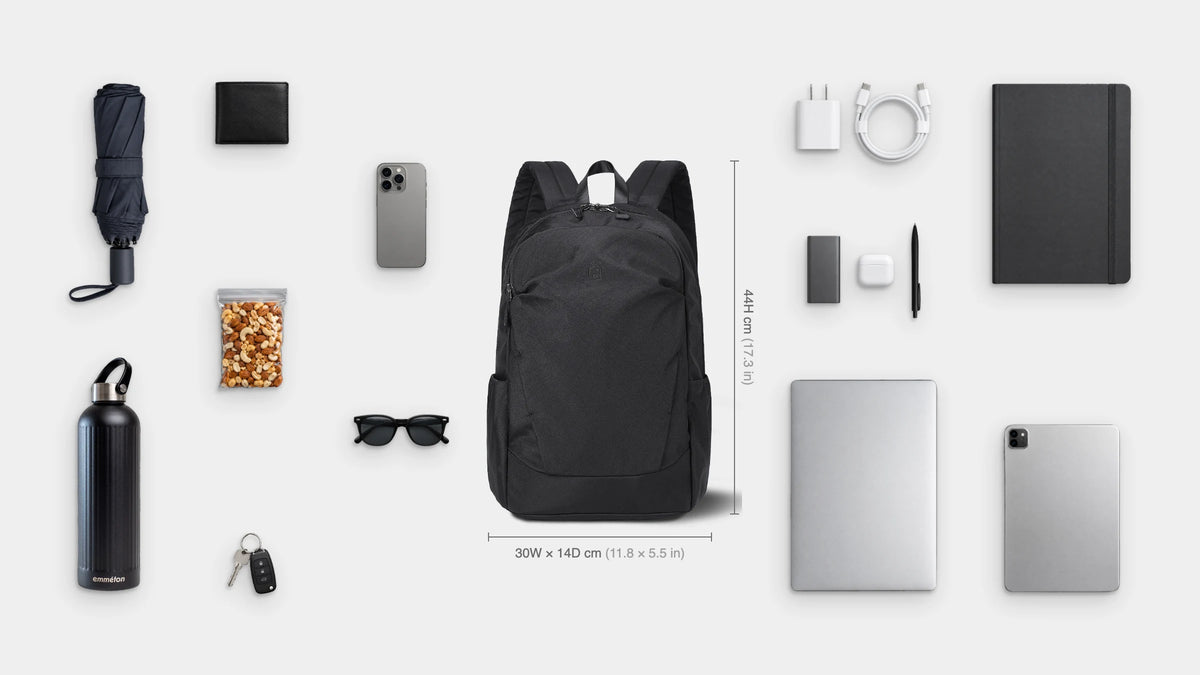 What fits inside the Tempo Anti-Theft Pack 18L: Shown: 14" laptop, iPad, notebook, charger and cable, power bank, earbuds, pen, emmèton Thermo Bottle 750ml, travel umbrella, snacks, sunglasses, wallet, keys, phone.