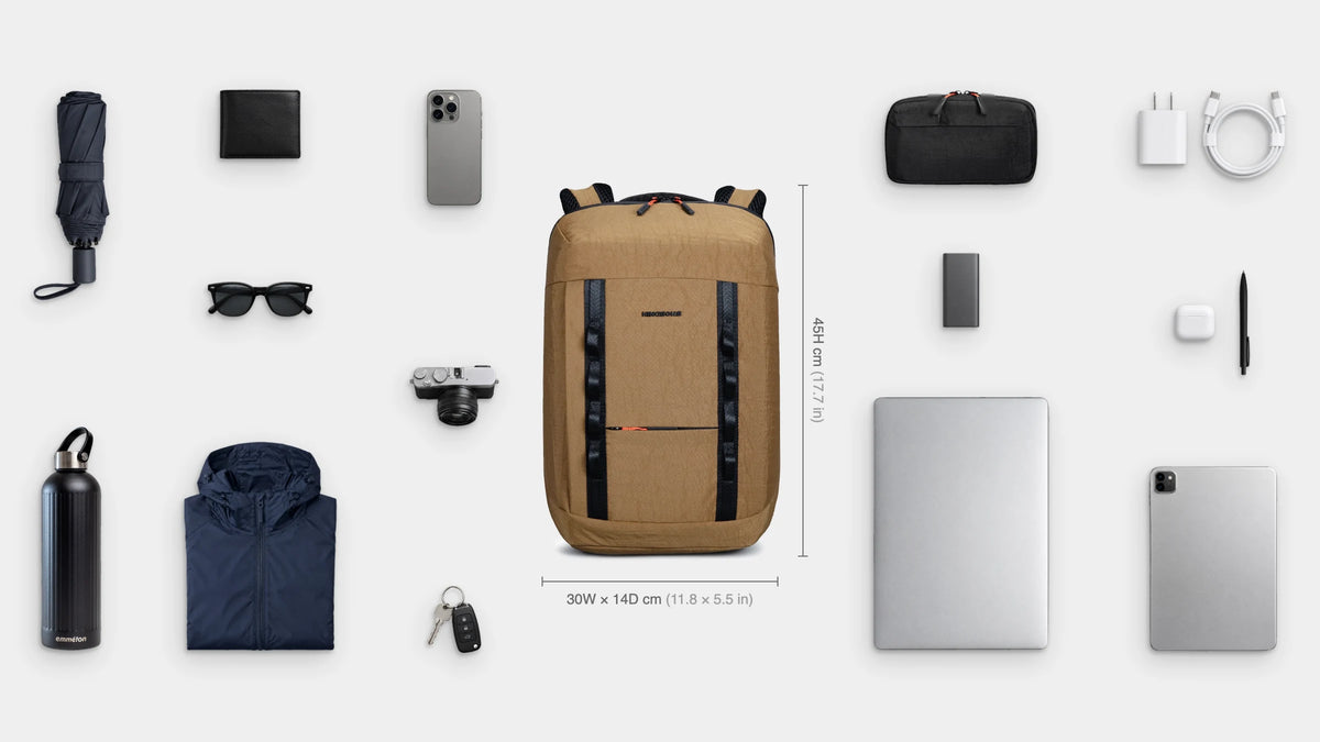 What fits inside the Urban Slim Pack 17.5L: Shown: 16" laptop, iPad, emmèton Flow Tech Pouch, charger and cable, power bank, earbuds, pen, camera, emmèton Thermo Bottle 750ml, packable rain jacket, travel umbrella, sunglasses, wallet, keys, phone.
